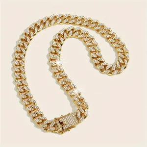 Detailed macro shot of the sparkling rhinestone pavé on a gold Cuban link chain