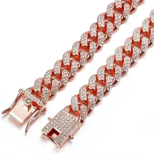 Detailed macro shot of iced out rose gold Cuban link necklace with pave set rhinestones