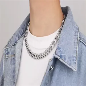 Detailed macro view of 12mm hip-hop Cuban link necklace with full diamond settings.