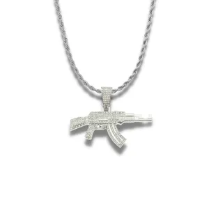 Detail of silver iced out AK-47 pendant necklace with sparkly rhinestones on rope chain