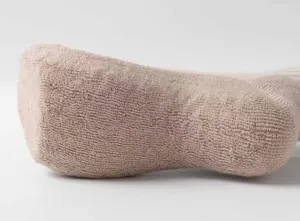 Macro detail of thickened terry fabric yoga socks showing soft non-slip cotton texture