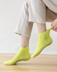 Breathable lime green anti-slip pilates socks with triangular grip pattern for yoga workouts