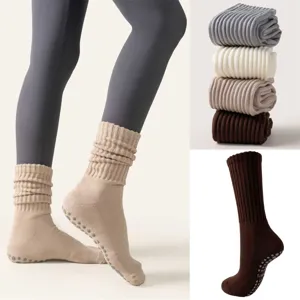 Detail of thickened anti-slip yoga socks with ribbed cuffs and grip dots for Pilates
