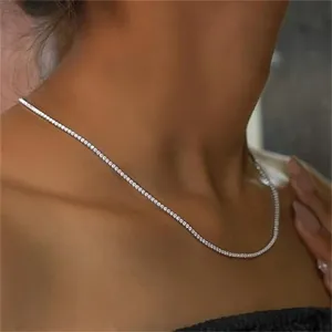 Elegant silver-tone tennis necklace with sparkling stones shown on a model neck