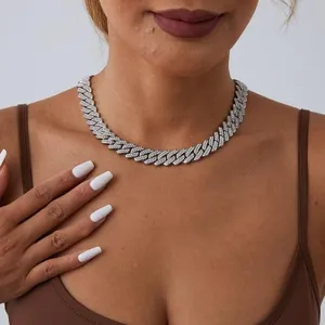 Close-up view of a bold double-row iced out cuban link necklace worn by a model