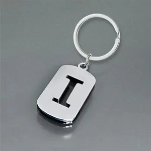 Close-up of a silver stainless steel keychain featuring a cut-out letter I design.