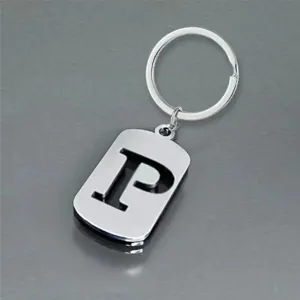 Detailed macro view of a minimalist stainless steel keychain with cutout letter P pendant