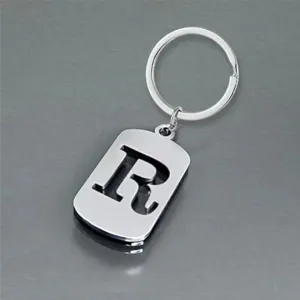 Detailed view of polished stainless steel keychain featuring a hollow letter R cutout