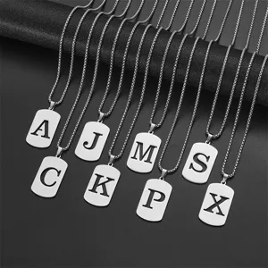 Set of stainless steel necklaces with cut-out alphabet letter pendants on black display