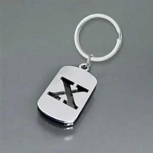 Detailed view of a silver stainless steel keychain featuring a hollowed-out letter X