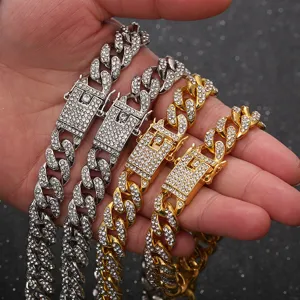Iced out Cuban link chains in gold and silver with sparkling rhinestones for hip hop style