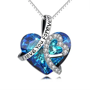 Elegant heart-shaped pendant necklace with blue crystal and "I love you forever" engraving