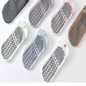 Collection of non-slip yoga socks with silicone grips in various pastel colors for Pilates