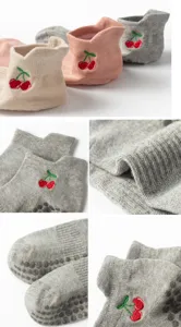 Detailed views of non-slip yoga socks showing cherry embroidery and silicone grips