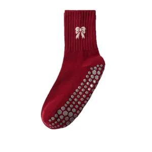 Professional red anti-slip yoga socks for women featuring white bow and hexagonal grips