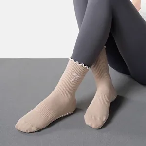 Professional non-slip yoga socks for women with arch support and silicone grips for Pilates