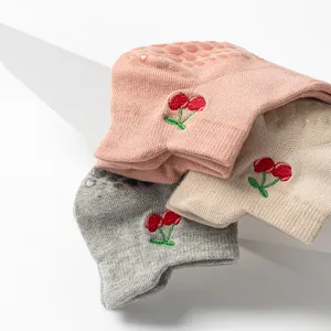 Non-slip yoga socks with cherry embroidery in pink, beige, and grey colors