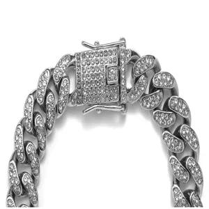 Detailed iced out silver Cuban link chain necklace featuring micro pave stones and box clasp.