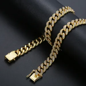 Iced out gold plated Cuban link chain necklace for hip hop streetwear enthusiasts.