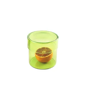 Minimalistische groene voorraadpot van borosilicaatglas met deksel voor thee en granen