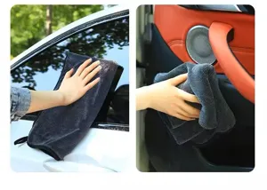 Detailed view of thick microfiber car cleaning cloth wiping a window and interior