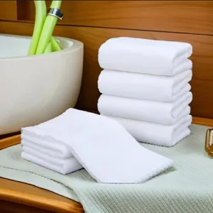 Soft and absorbent pure white cotton towels ideal for hotel salon and professional travel use