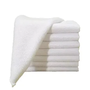 Premium stack of white microfiber square cleaning towels for commercial kitchens and bakeries