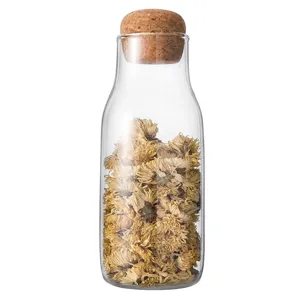 Elegant clear borosilicate glass storage jar with round cork lid for tea and dry food.