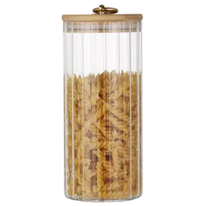 Airtight ribbed borosilicate glass storage canister with bamboo lid and gold ring pull