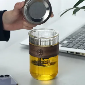 High borosilicate hammered glass tea mug with heat-insulating wooden sleeve