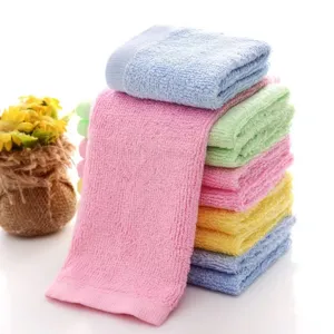 Stack of thickened wood fiber washcloths in various colors for kitchen and bathroom
