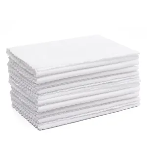 Detailed view of a thick stack of absorbent white quick-dry towels for home or hotel use.
