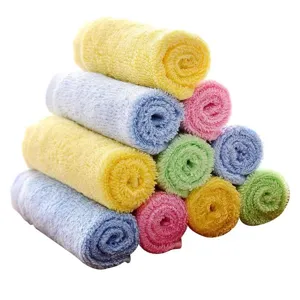 Close-up view of thick absorbent wood fiber dishcloths stacked in vibrant assorted colors
