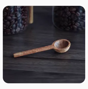 Macro detail of a natural wooden measuring spoon for kitchen storage spice jars