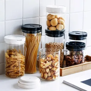 Set of airtight glass storage jars for kitchen food organization and vacuum sealing.