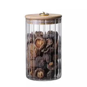 Bocal de rangement en verre strié avec couvercle en bambou et anneau doré