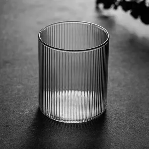 Minimalist heat-resistant fluted glass water cup with elegant vertical ribbing texture