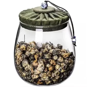 Tarro de almacenamiento de té en vidrio borosilicato con tapa de tela verde plisada