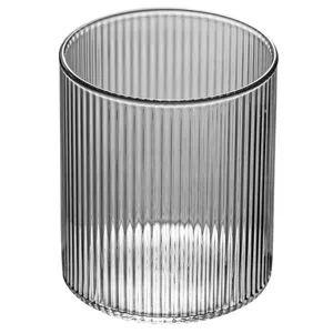 Heat-resistant minimalist ribbed glass cup for coffee or tea with a clean vertical texture