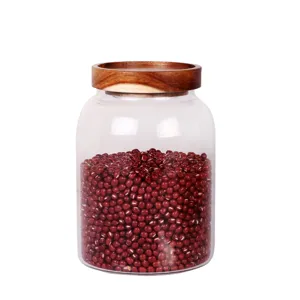 Grand bocal de stockage en verre avec couvercle en bois d acacia rond transparent.