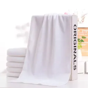 Pure white absorbent disposable hotel towels with soft texture for spa and salon use