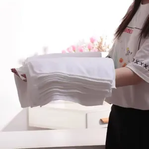 Professional absorbent white disposable bath towels for hotel, spa, and salon use