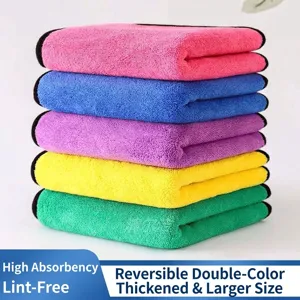 Stack of colorful microfiber cleaning towels in pink blue purple yellow and green