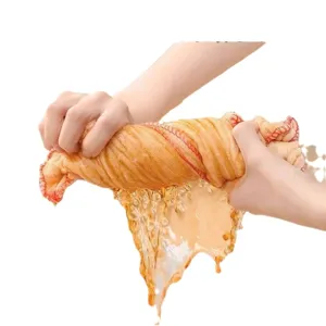 Heavy-duty pure cotton gauze dishcloth showing high water absorption while wringing