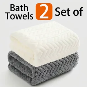 Detailed macro view of two quick-drying thickened bath towels in white and dark grey colors
