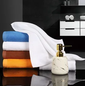 Detailed view of soft colorful cotton hand towels with plush loops in bathroom setting