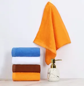 Soft cotton square washcloths in various colors with marble soap dispenser detail