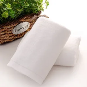 Detail close-up view of white pure cotton square towel with soft and absorbent textured weave