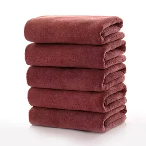 Set of 5 thickened absorbent dark red microfiber towels stacked on white