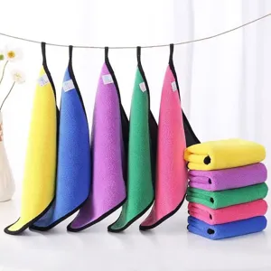 Vibrant multi-colored microfiber cleaning cloths hanging and folded in a neat stack